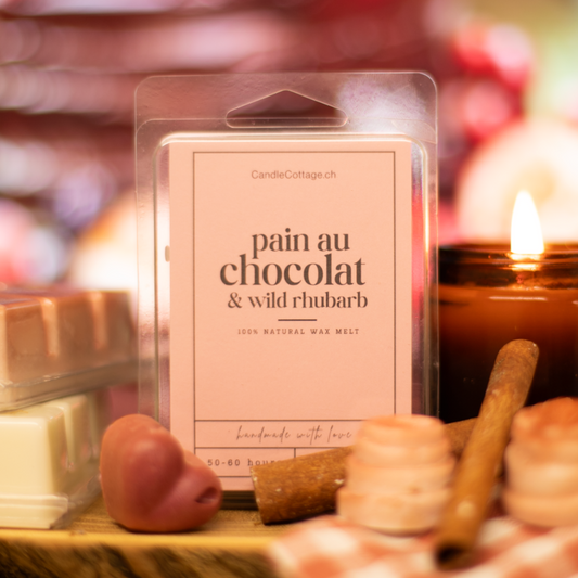 Pain au Chocolat & Wild Rhubarb wax melts with warm candle and cozy ambience.